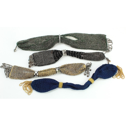 457 - Purses. A group of four cut steel beaded misers purses, circa 19th Century, largest 31cm approx.