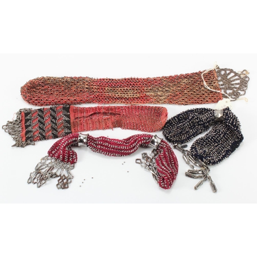 458 - Purses. A group of four cut steel beaded misers purses, circa 19th Century, largest 34cm approx.