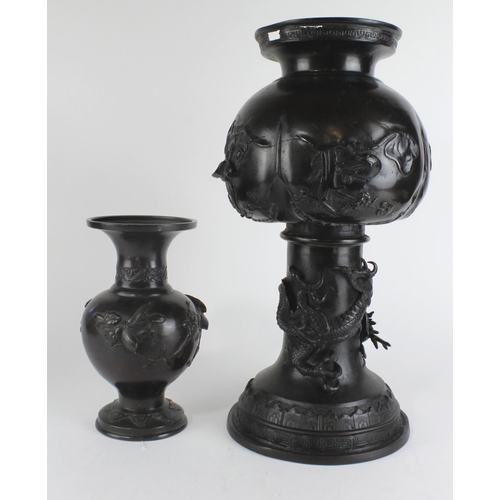 492 - Two bronze vases, decorated with dragons and birds, the larger of the two has been altered possibly ... 