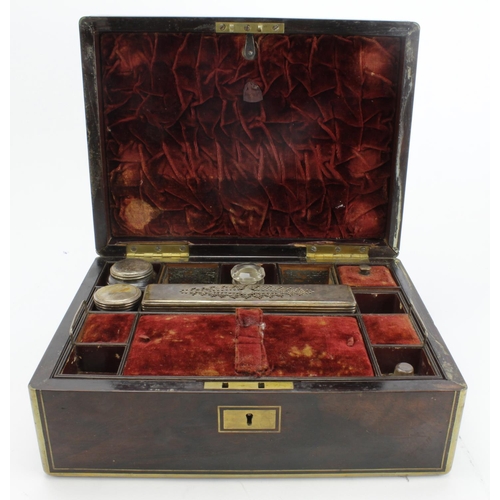 507 - Walnut veneered vanity case with brass mounts, containing some silver plated topped jars, height 12.... 