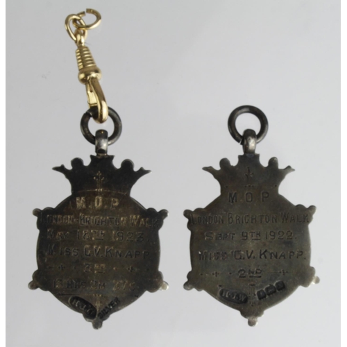 1328 - Fobs (2) hallmarked silver, M.O.P. London Brighton Walk 1922 and 1923 to Miss G.V. Knapp, 2nd and 3r... 