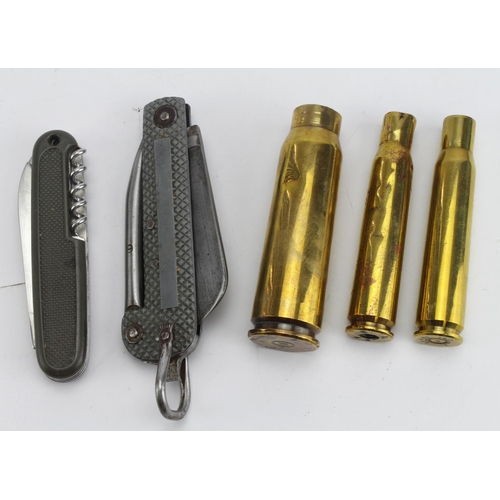 1525 - Penknives an RN type, a German type and some shell cases