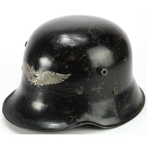 1603 - German 3rd Reich M18 Pattern Luftshutz Helmet. Surplus WW1 helmets were used during the early days o... 