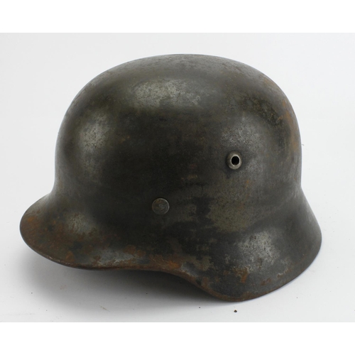 1808 - German steel combat helmet a small plain feldgrau example, M35, batch number, 3676 ? with liner