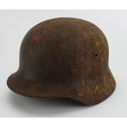 1810 - German steel combat helmet re used by Italian Partisans 