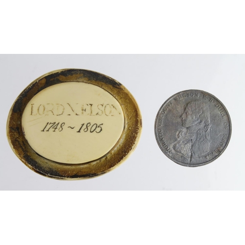 2127 - Nelson interest a Trafalgar medal, Victorian 1905 electrotype most likely and a small pot lid, one s... 