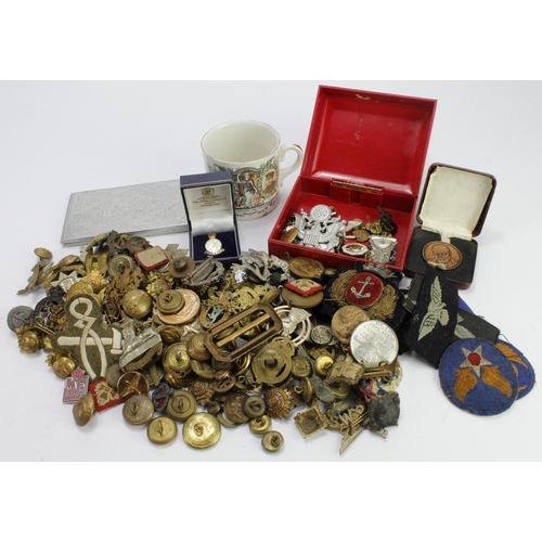 2145 - Plastic tub of Cap Badges, military buttons, pips, cigarette tin, etc etc. (Qty)