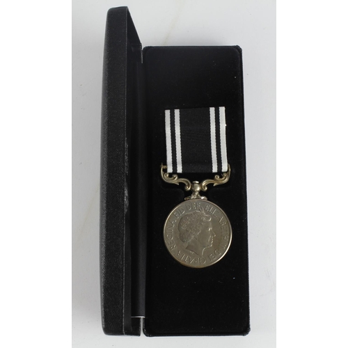 2165 - Prison Long Service and Good Conduct Medal QE2 in case of issue. Named (SO G Hutton EV 024).