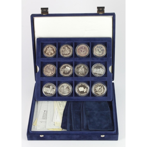 806 - World proof and commemorative coins (21) mostly silver, 1990s, in a Westminster case (World at War c... 