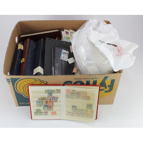 946 - Banana box with stamps on leaves, in albums, stock books, on paper etc etc. Heavy lot. (Buyer collec... 