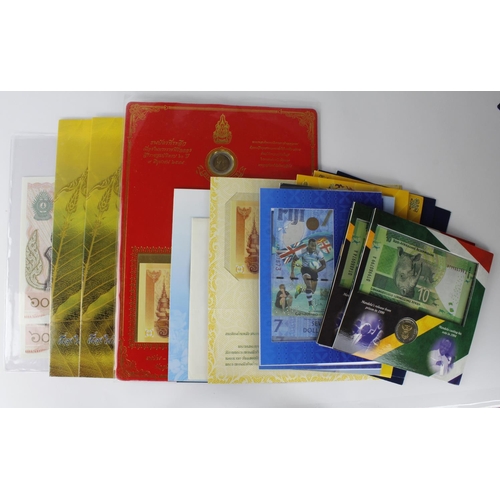 1062 - World group of commemorative notes/Uncut sheets and coins in presentation folders, Thailand, Fiji, R... 