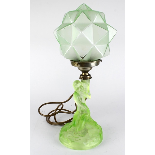 1046 - Art Deco green glass table lamp, depicting a lady sitting holding a polygon shade, approx 40cm high.... 