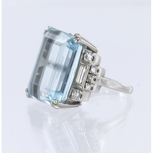 107 - Platinum ring set with a step cut aquamarine measuring approx. 17mm x 14mm, with diamond set shoulde... 