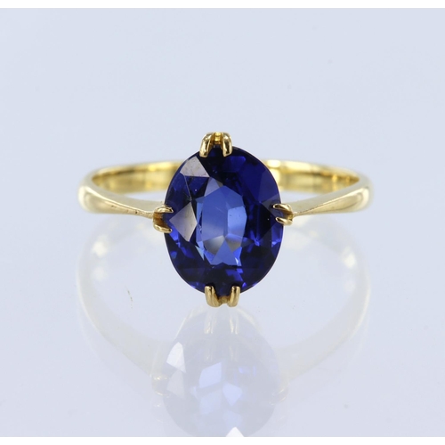 122 - 18ct yellow gold ring set with a single oval sapphire measuring approx. 9.5mm x 7.5mm in double claw... 