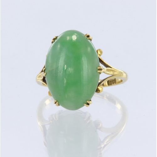 127 - Tests 18ct yellow metal jadeite solitaire ring, oval cabochon jadeite measures 17mm x 11mm, six doub... 