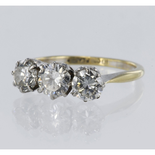 129 - Yellow and white metal stamped '18CT PLAT' diamond trilogy ring, round brilliant cut diamonds approx... 