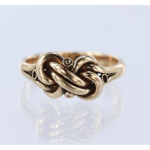 130 - Stamped '9ct' rose gold knot ring, finger size, N, weight 3.6g.