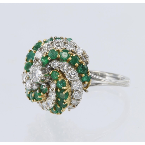 137 - White metal tests 18ct diamond and emerald spiral cluster ring, principle round brilliant cut diamon... 