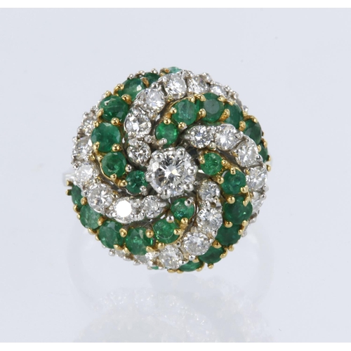 137 - White metal tests 18ct diamond and emerald spiral cluster ring, principle round brilliant cut diamon... 