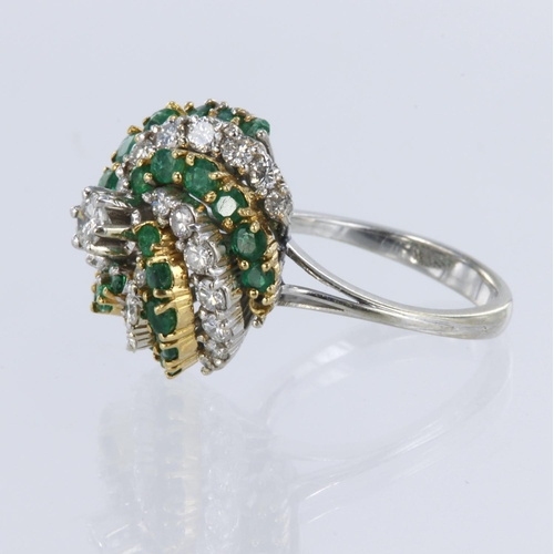 137 - White metal tests 18ct diamond and emerald spiral cluster ring, principle round brilliant cut diamon... 