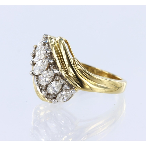 144 - 18ct yellow gold crossover style ring set with seven graduated marquise cut diamonds, with a further... 