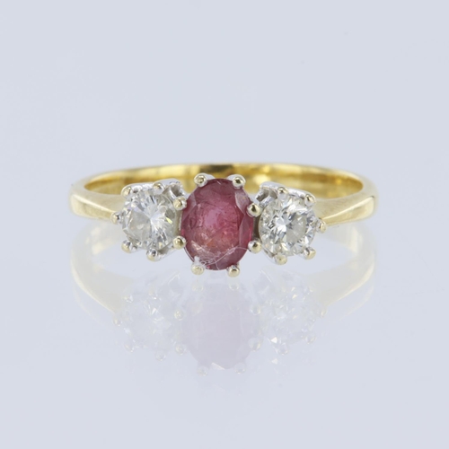 159 - 18ct yellow gold diamond and ruby trilogy ring, oval mix cut ruby measures 5mm x 4mm, set with two r... 