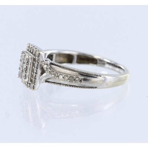 185 - 9ct white gold ring with rectangular shaped head set with six round brilliant cut diamonds, framed b... 