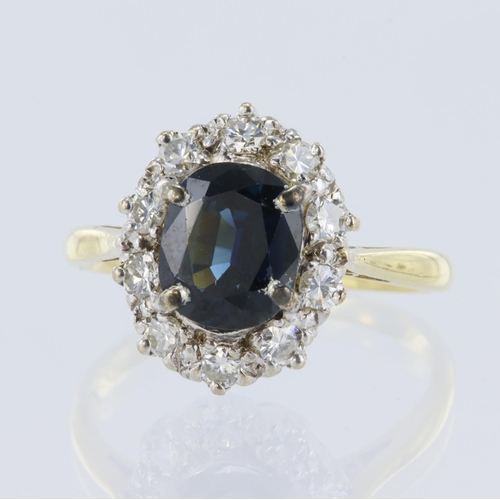 190 - Yellow metal (Tests over 15ct) teal sapphire and diamond cluster ring, oval cut sapphire measures 8m... 