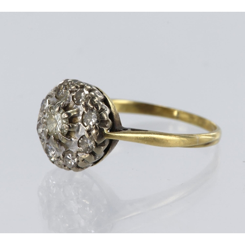 216 - Tested 18ct yellow gold cluster ring, set with nine diamonds, principle round cut weighing approx 0.... 