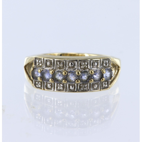 218 - 9ct yellow gold three row half eternity ring set with a central row of seven round pale tanzanites, ... 