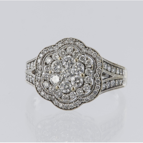 228 - 18ct yellow gold daisy ring, set with 81 diamonds, an estimated total weight of 1.5ct, finger size U... 