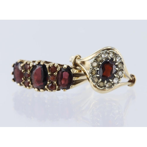 232 - Two rings to include 9ct yellow gold boat shaped ring set with nine garnets, finger size Q. 9ct yell... 