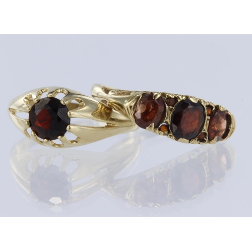 274 - Two garnet rings to include 9ct yellow gold solitaire ring in gypsy setting, stone measures 7mm in d... 