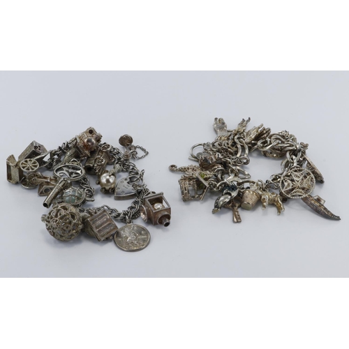 280 - Two silver charm bracelets, various British hallmarks on catches, numerous silver charms. Weighs 3.2... 