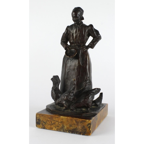 438 - After Paul Moreau Vauthier. Bronze figure depicting a female figure feeding chickens, signed to base... 