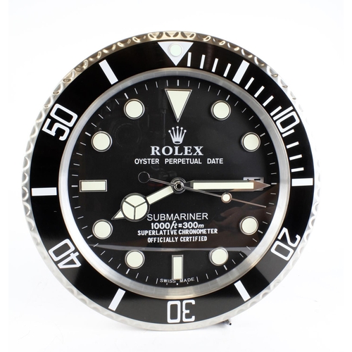 710 - Advertising Wall Clock. Black 'Rolex' advertising wall clock, black dial reads 'Rolex Oyster Perpetu... 