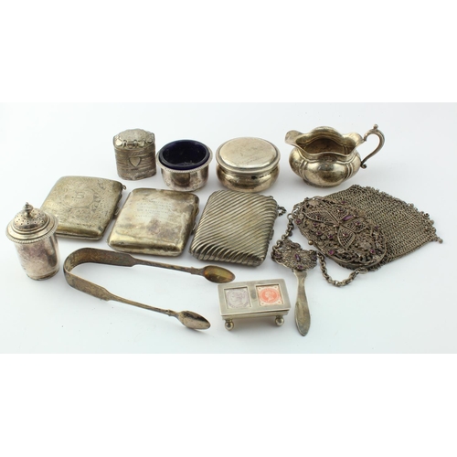 807 - Mixed silver. A group of various silver items, including cigarette cases, stamp holder, trinkets, et... 