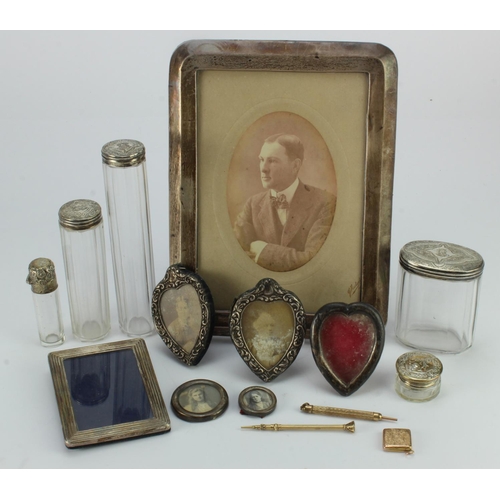 822 - Silver & White Metal. A group of various silver and white metal picture frames, glass jars, etc. (so... 