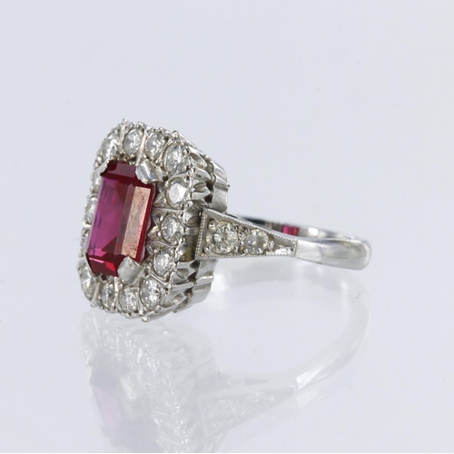 83 - 18ct white gold ring featuring a step cut red stone (synthetic ruby?) measuring approx. 7mm x 5mm su... 