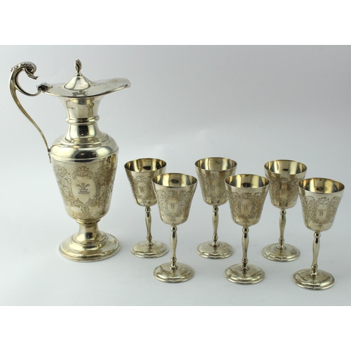 859 - Silver wine jug and six silver cups, with scroll decoration, hallmarked 'CSG&Co., Birmingham, 1975-1... 