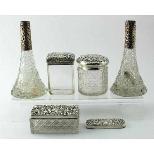 875 - Three silver topped glass toilet jars and two  silver topped glass perfume bottles (both missing sto... 