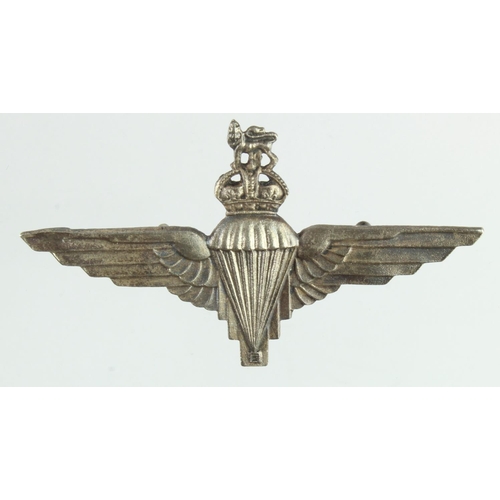1080 - Badge an unhallmarked but silver ? Parachute Regiment cap badge Kings Crown.