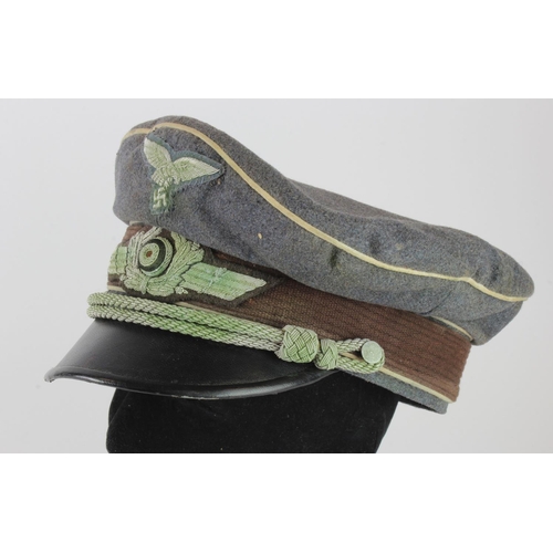 1294 - German Luftwaffe Officers peaked cap, service wear, white piped for HG Division, Erel makers label.