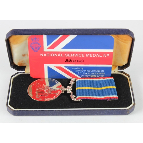 1586 - National Service medal in case.