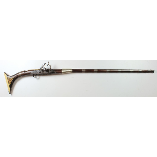 1929 - North African, probably Moroccan, Snaphaunce rifle. Classic decoration, fish tail buttstock with fin... 