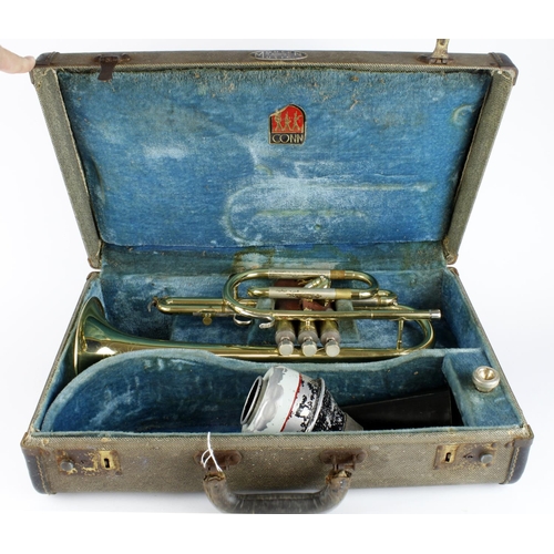 303 - Conn trumpet with mouthpiece, contained in a Conn case