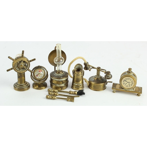 316 - Brass miniatures. A group of six brass miniatures, including binnacle, compass, coal scuttle (with f... 