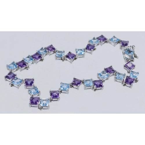 125 - 9ct white gold amethyst and topaz line bracelet, sixteen square cut amethyst's and topaz both measur... 