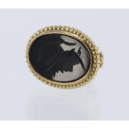 174 - 9ct yellow gold seal fob, carved onyx intaglio of a warrior head, measurements 23mm x 19mm, weight 4... 