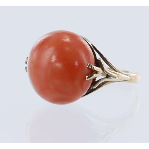 2 - Yellow gold (tests 12ct) antique coral ring, circular coral cabochon measures 16mm, flanked with a d... 